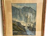 framed picture of a painting of a mountain scene with a bridge