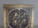 an image of a clock made out of metal with gears and gears on it