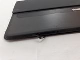 an open laptop computer sitting on top of a white surface