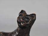 an image of a statue of a cat sitting on top of a table