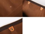 a close up of the inside of a brown leather bag