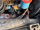 a close up of a car ' s engine with the hood open