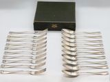 a lot of forks sitting on a table next to a box