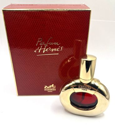 an image of a bottle of perfume sitting next to a box