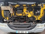 a truck that has a bunch of wires in the trunk