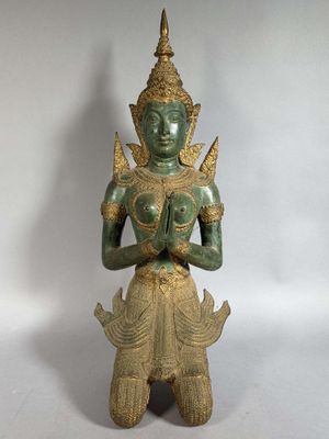 an image of a statue of a woman holding a baby