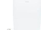 a white portable air conditioner sitting on top of a white table