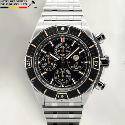 a watch that is sitting on a white surface