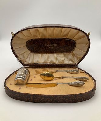 a case with silverware inside of it on a table