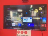 a flat screen tv mounted on the wall in a room