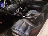 a picture of the inside of a car with the door open