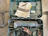 a tool box with tools in it sitting on the floor