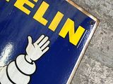 a sign that says michel on the side of a building
