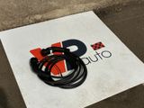 a sign with a cord attached to it on the ground