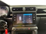 the dashboard of a car with a car key in the center of it