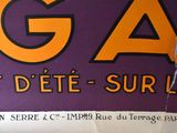 a sign that says aga on the side of a building