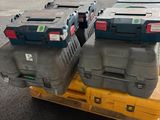 many boxes on a pallet in the middle of the street