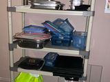 a shelving with many items on it in a room
