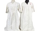 pair of white medical gowns on mannequins on a white background