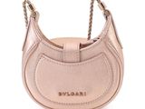 a close up of a pink purse on a white background