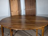 a table with two chairs sitting on it in a room