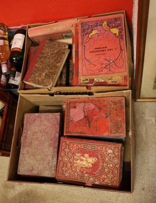 many boxes of books sitting on the floor next to each other
