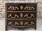an antique chest of drawers with a marble top and gold decoration