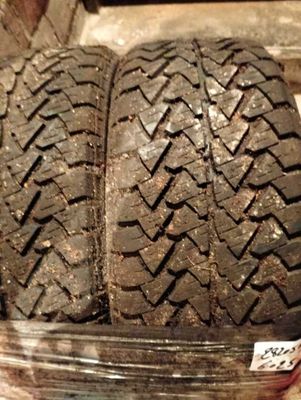 two tires in a plastic container on a table