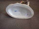a white porcelain figurine of a bird on a table