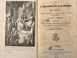 an old book with a picture of a man in a bed