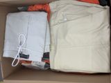 a box full of clothes and a pair of pants in it