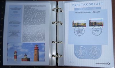an open book with a picture of a lighthouse on it