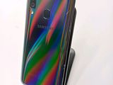 the back of a samsung galaxy note 10 lite with a rainbow - colored back
