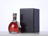 an image of a bottle of liquor next to a black box
