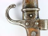 a close up of a metal object on a white surface