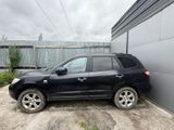 a picture of a black suv parked in front of a building
