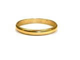 an image of a gold wedding ring on a white background