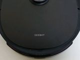 an image of a robotic vacuum cleaner sitting on top of a table