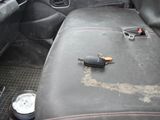 an image of a car seat with a gun on it