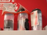 two water bottles sitting on top of a red box