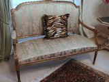 a zebra print pillow on a chair in a room