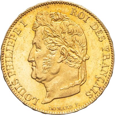 Gros plan sur une pièce d'or portant une tête d'homme
