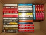 a lot of cassettes in a box on a table