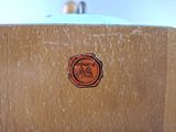 a close up of a piece of wood with a stamp on it