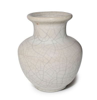a white vase with a cracky design on it