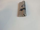 an image of a metal door lock on a white surface