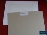 two sheets of paper sitting on top of a red table