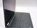 a laptop with a black keyboard on a white surface