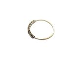 an image of a silver ring with black diamonds on a white background
