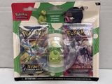 two packs of pokemon trading cards are in the packaging